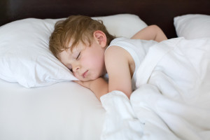 Little Sweet Toddler Boy Sleeping In His Bed